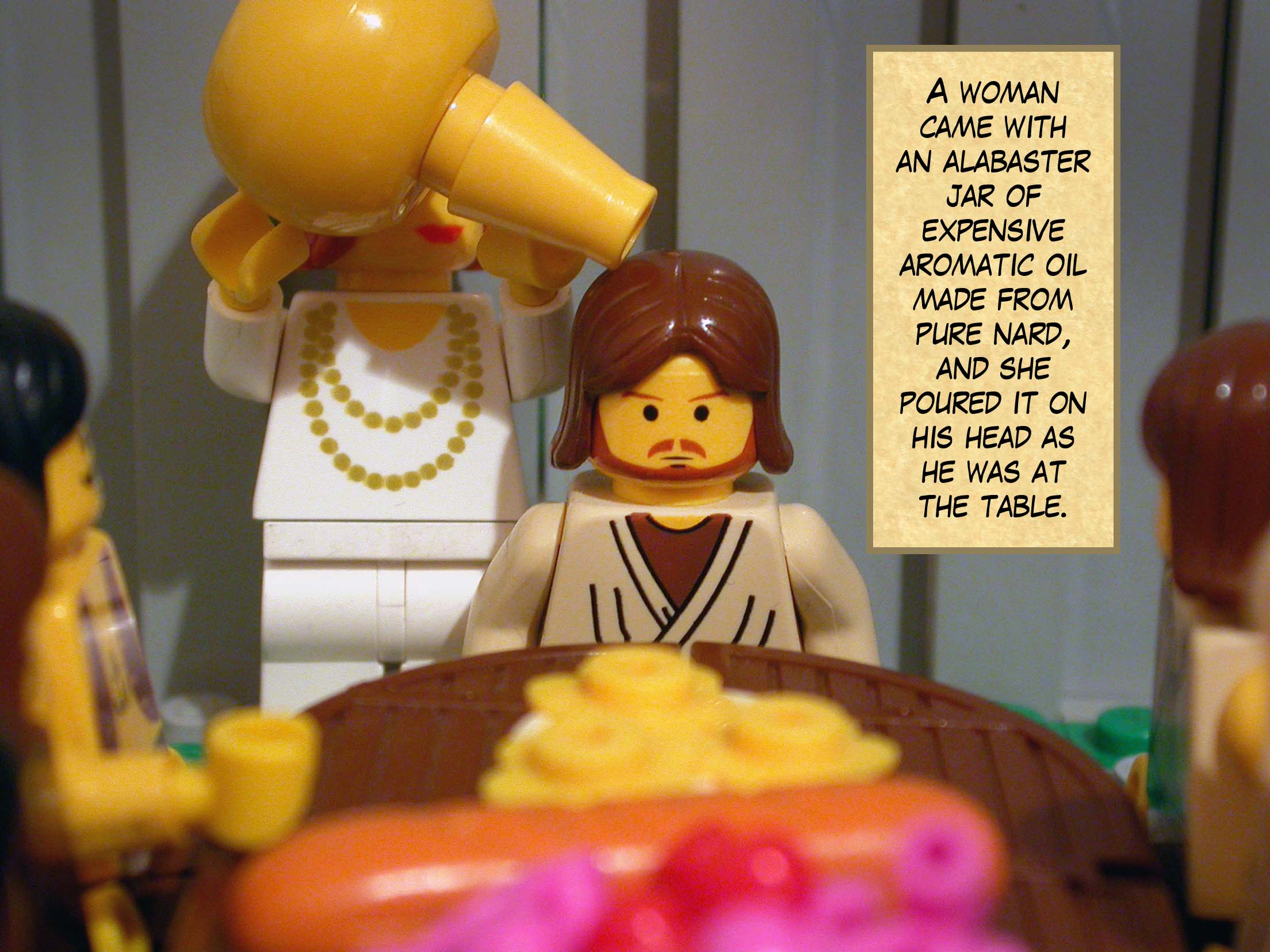 A woman came with an alabaster jar of expensive aromatic oil made from pure nard, and she poured it on his head as he was at the table.