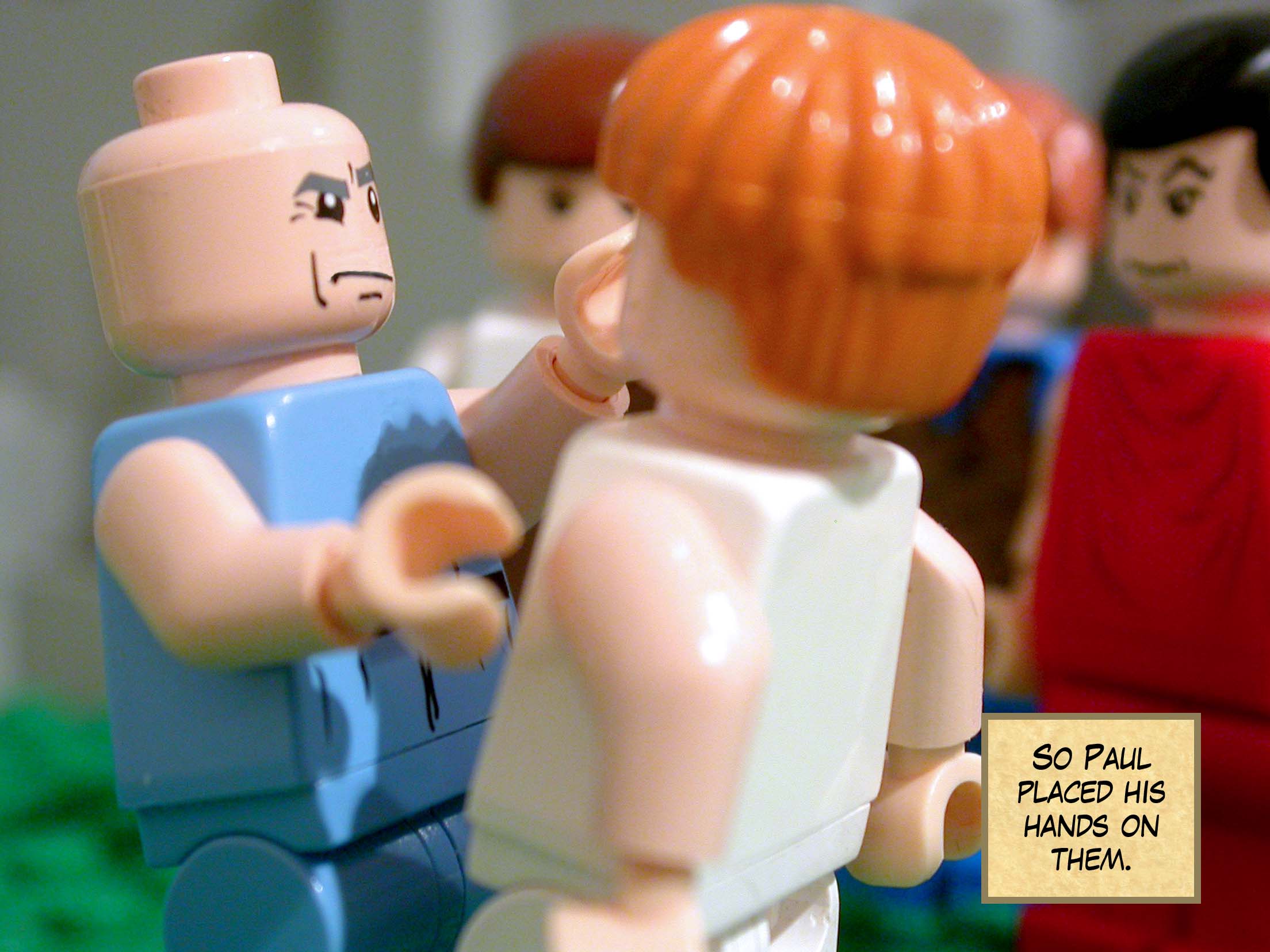 So Paul placed his hands on them.