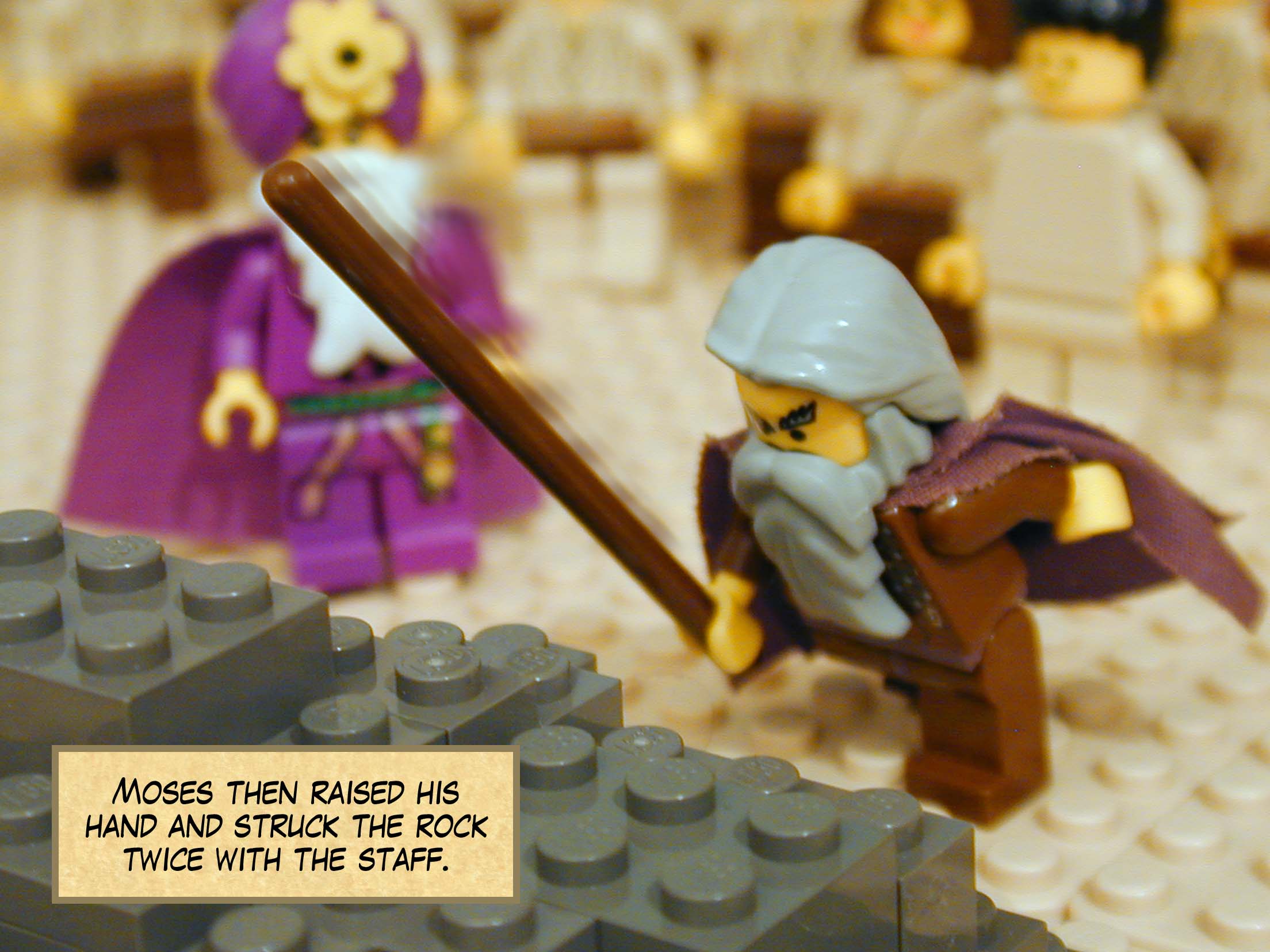 Moses then raised his hand and struck the rock twice with the staff.