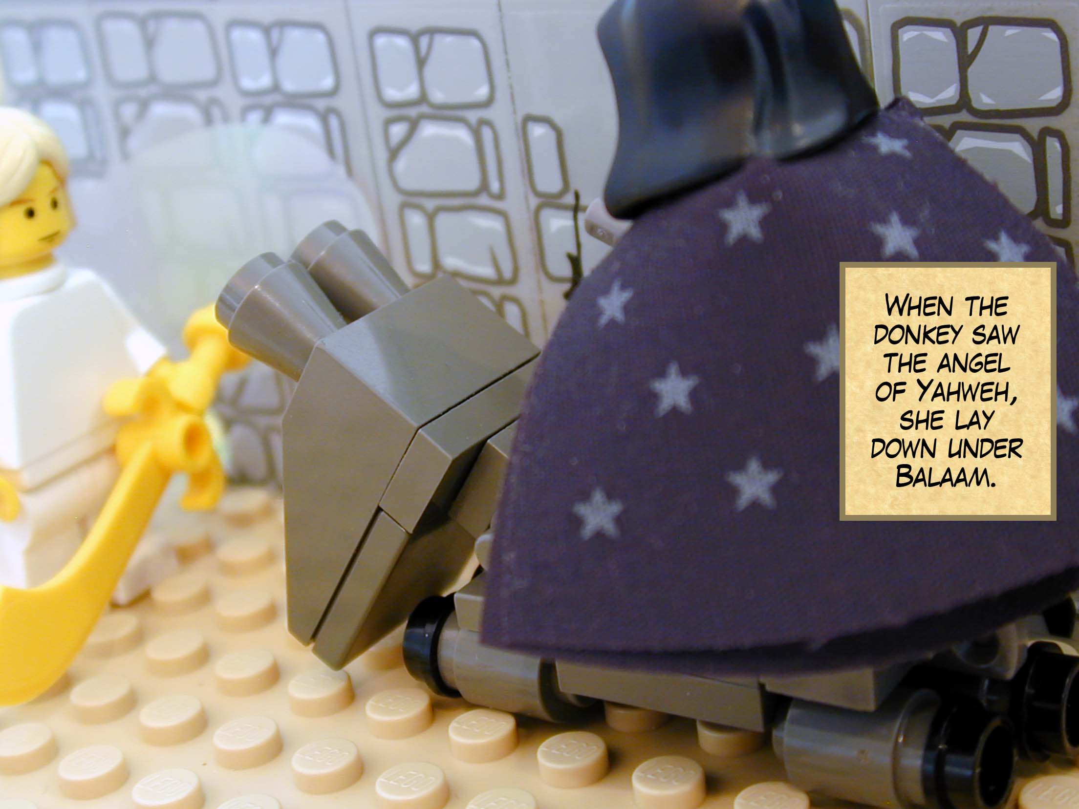 When the donkey saw the angel of Yahweh, she lay down under Balaam.