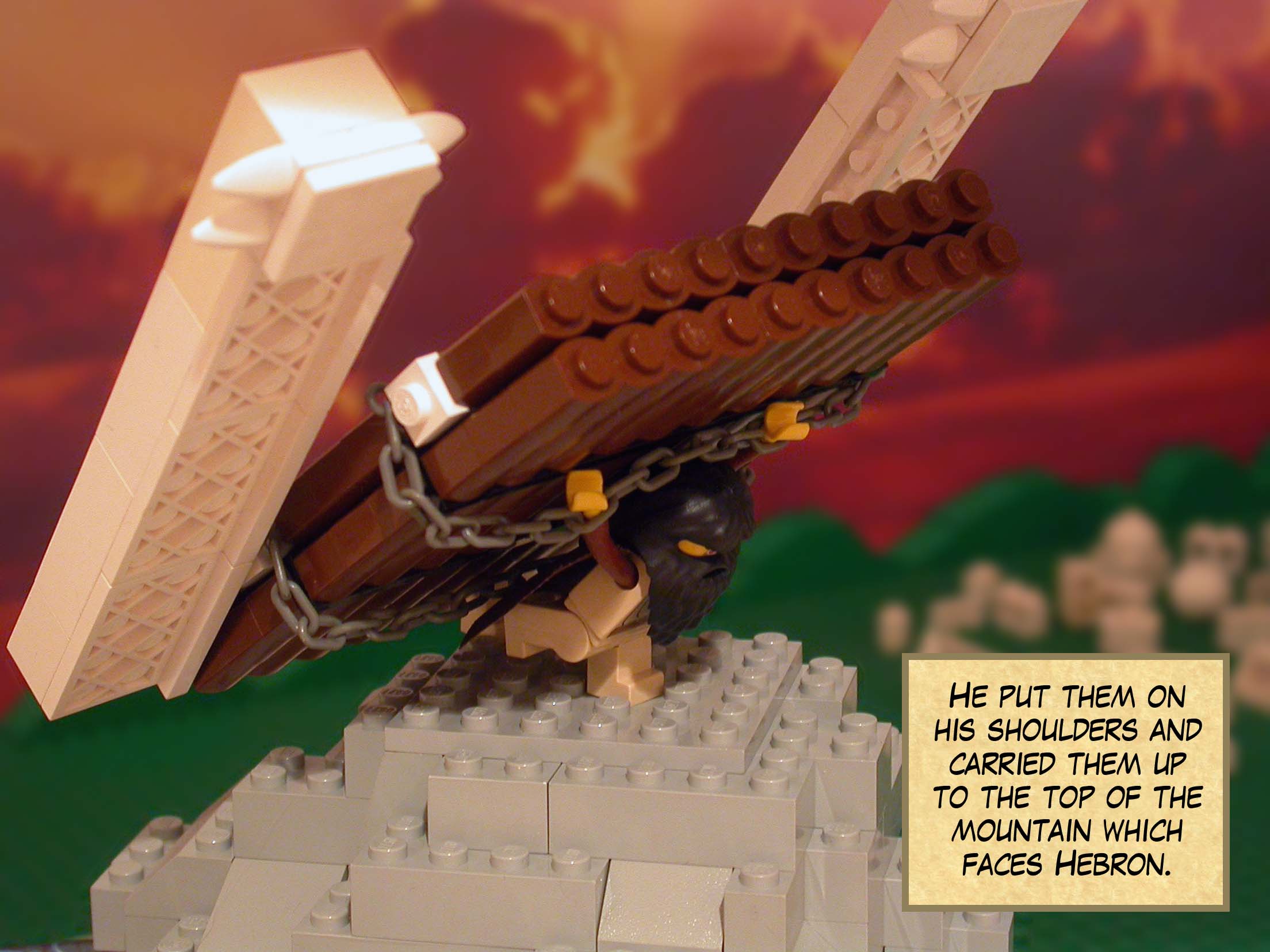 He put them on his shoulders and carried them up to the top of the mountain which faces Hebron.