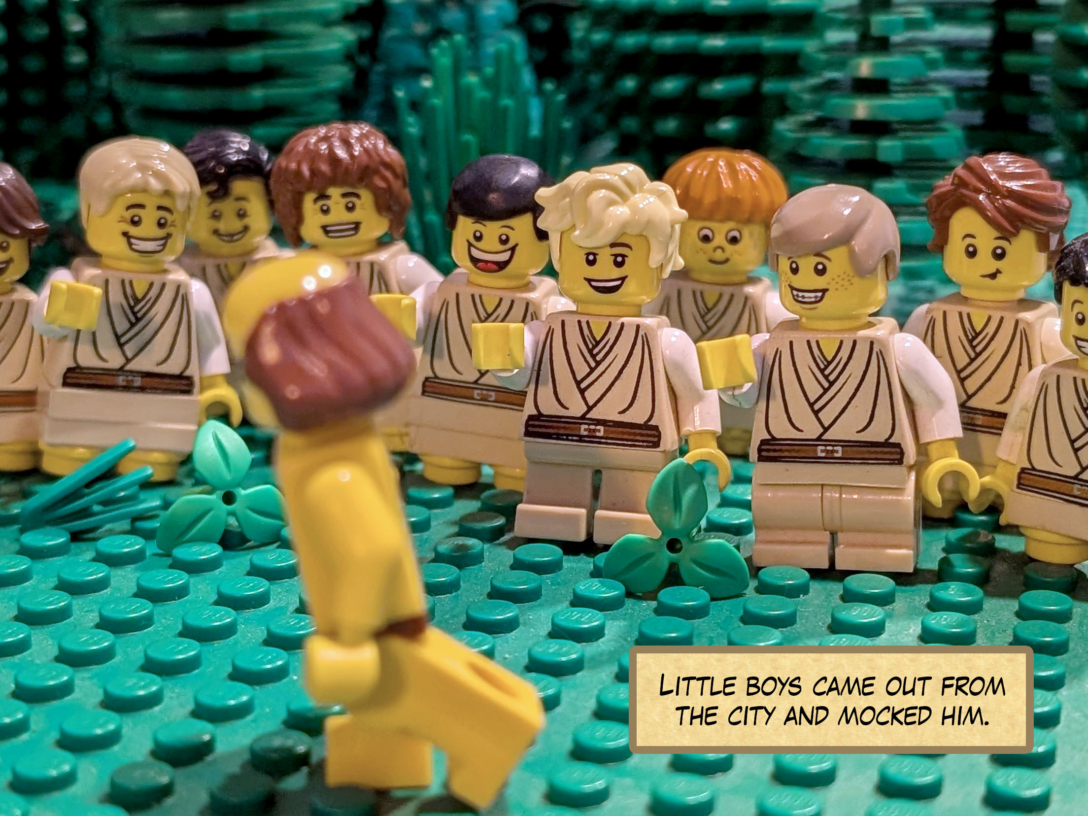 Little boys came out from the city and mocked him.